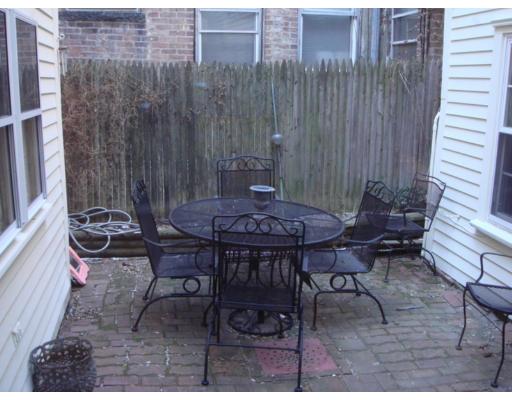 43 South Russell Boston, MA 02114 - Photo 8 of 8 a view of a patio with a table and chairs