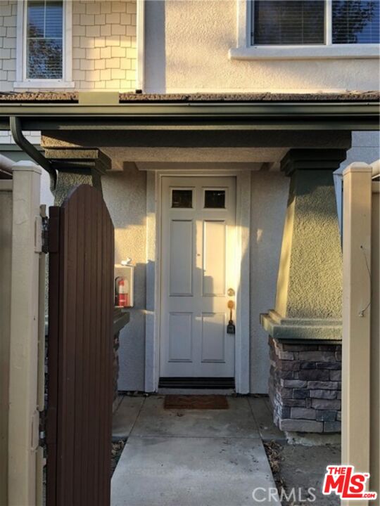 9497 Jack Rabbit Drive, Unit 106 Rancho Cucamonga, CA 91730 - Photo 2 of 14 a view of front door of house