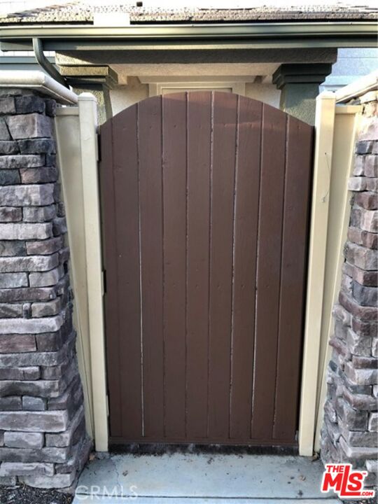9497 Jack Rabbit Drive, Unit 106 Rancho Cucamonga, CA 91730 - Photo 3 of 14 a view of entryway with wooden walls