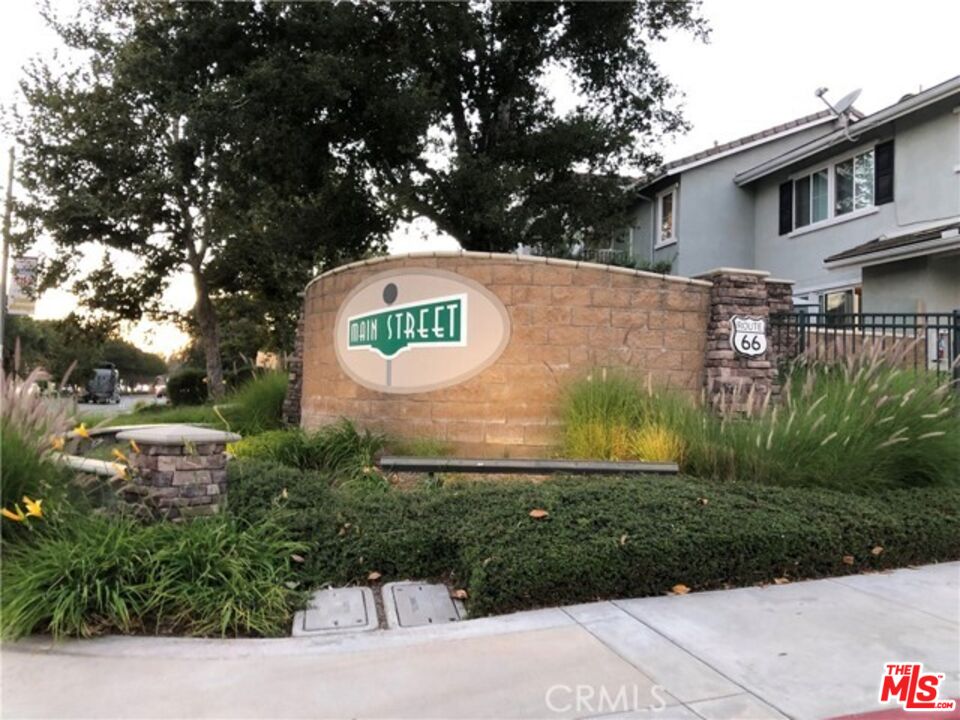 9497 Jack Rabbit Drive, Unit 106 Rancho Cucamonga, CA 91730 - Photo 7 of 14 a sign that is on the side of a building