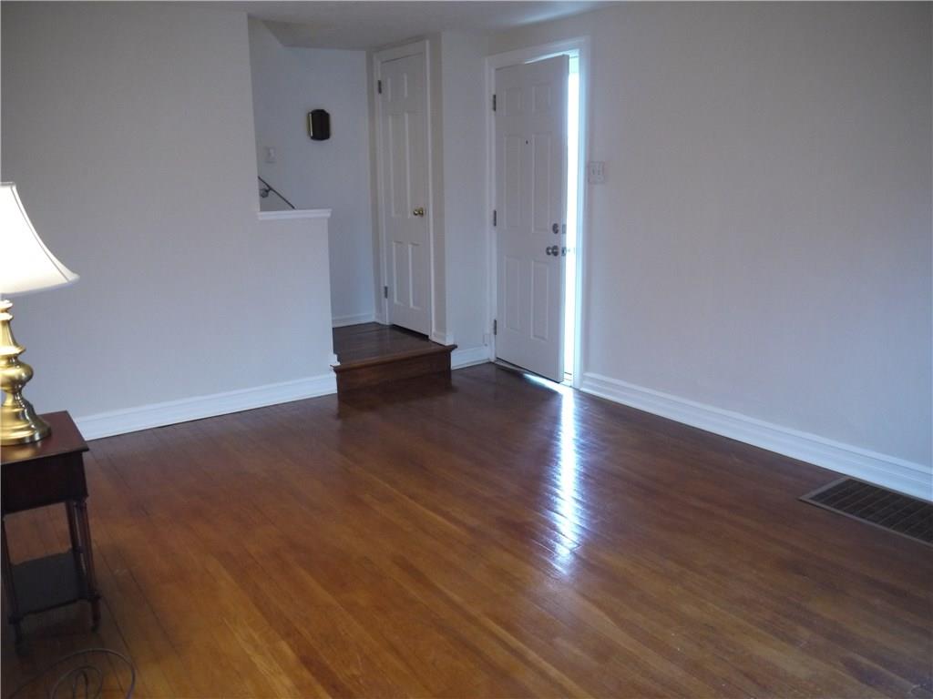 568 Highview Road Pittsburgh, PA 15234 - Photo 3 of 25 Entry into the large family room that showcases beautiful hardwood floors.