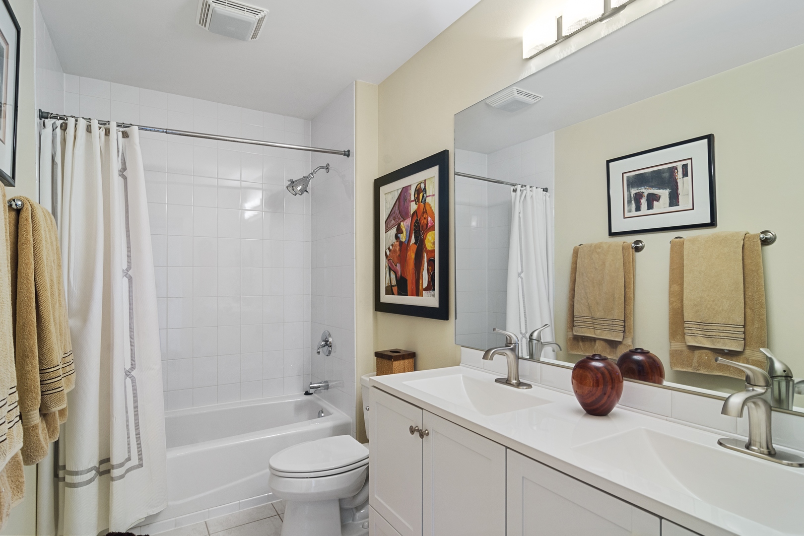 1532 West Rue James Place Palatine, IL 60067 - Photo 14 of 16 a bathroom with a double vanity sink a toilet a mirror and shower