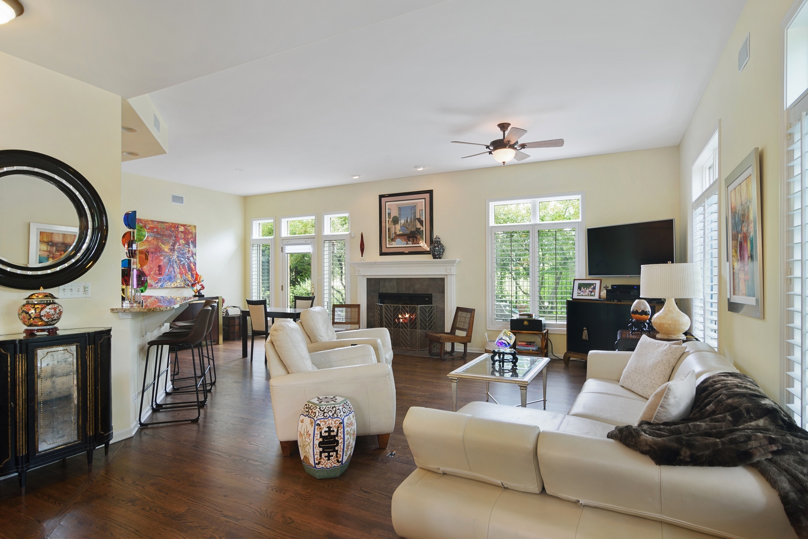 1532 West Rue James Place Palatine, IL 60067 - Photo 7 of 16 a living room with furniture a fireplace and a flat screen tv