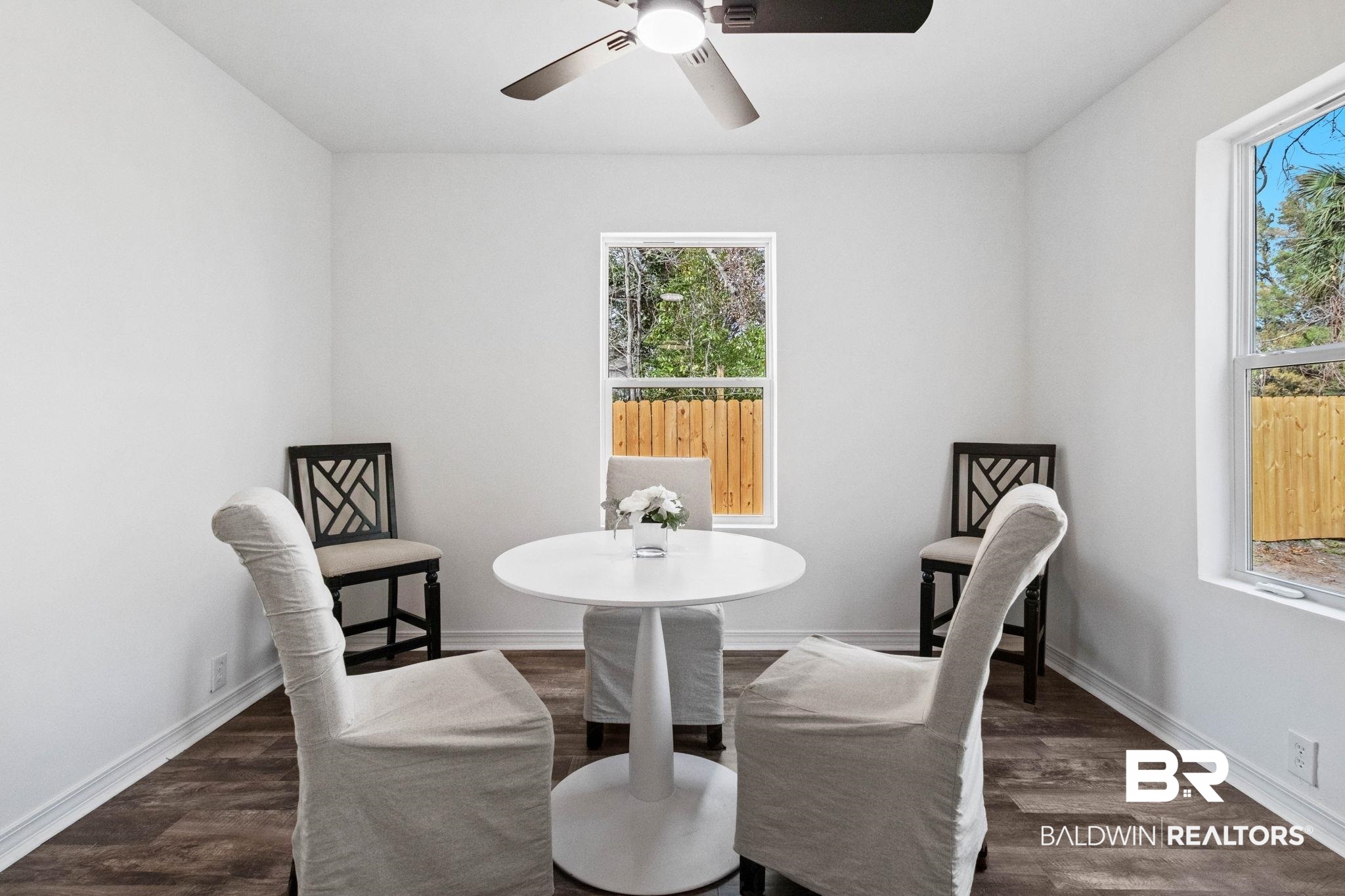 128 Bush Avenue Mobile, AL 36604 - Photo 15 of 40 Dining area with dark wood finished floors and ceiling fan