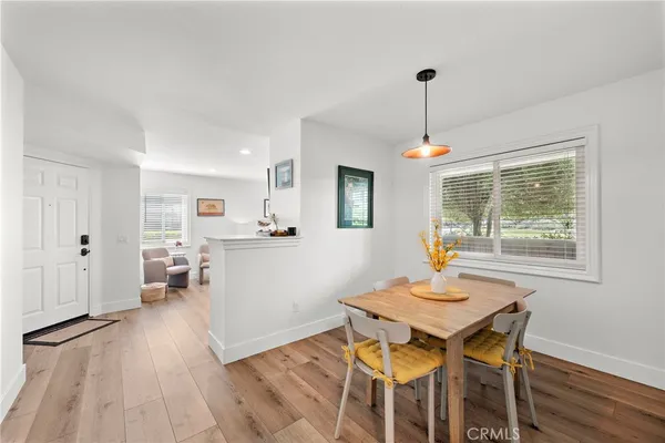 a view of a dining room with furniture window and wooden floor