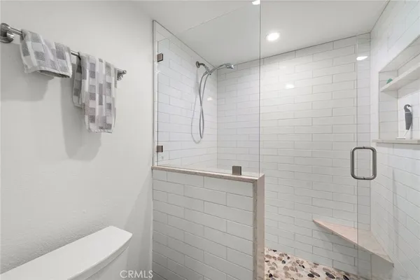 a bathroom with a shower and a toilet