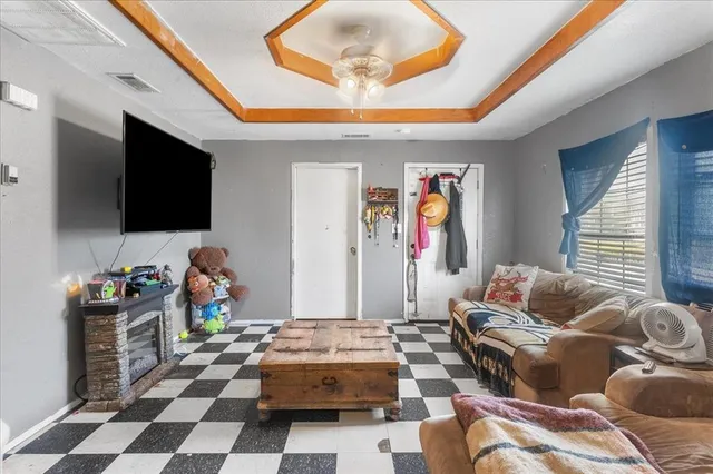 a living room with furniture and a flat screen tv