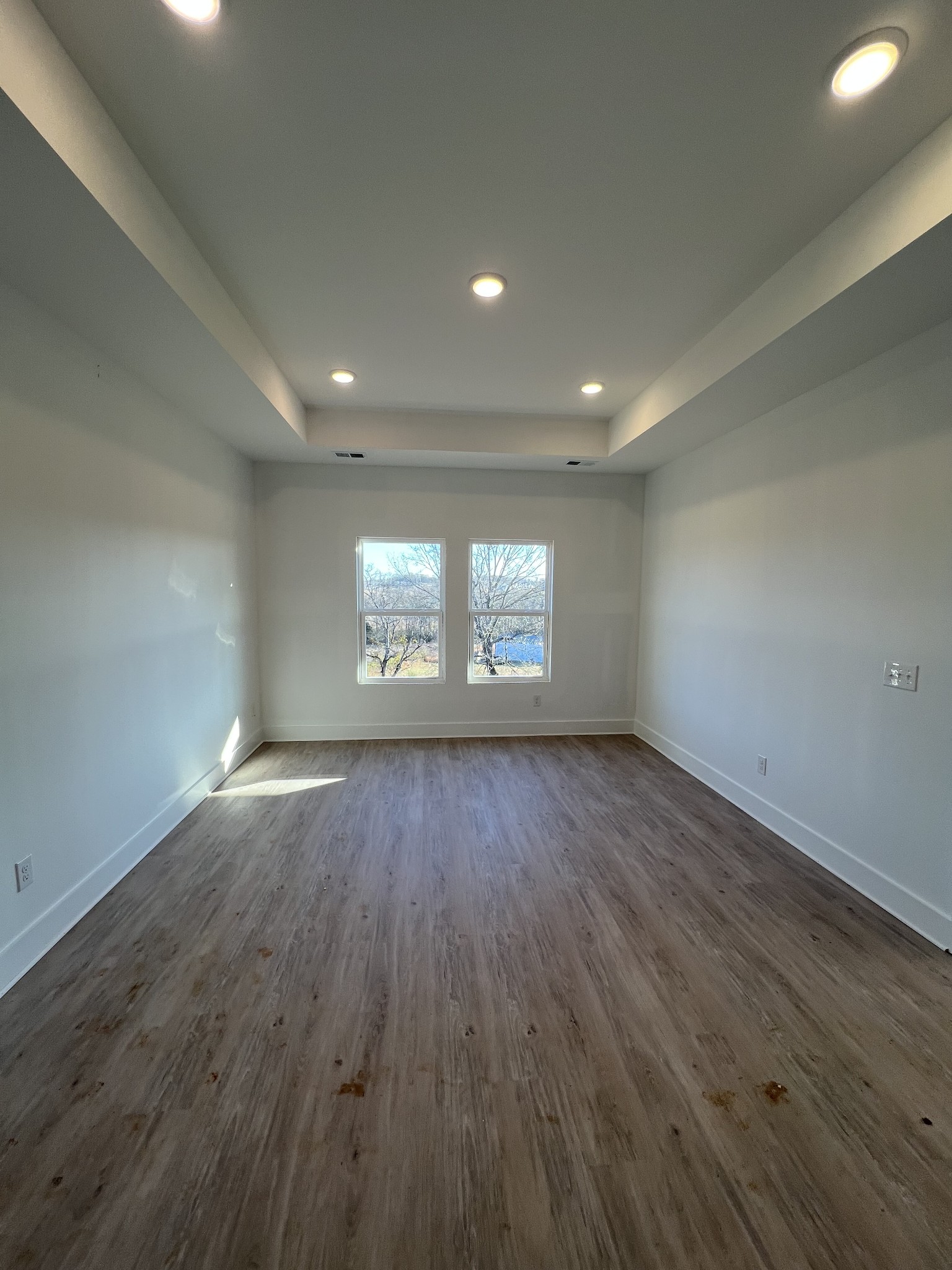 309 Strong Street Columbia, TN 38401 - Photo 11 of 33 an empty room with wooden floor and windows