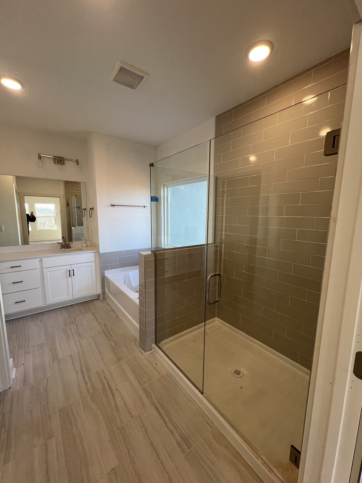 309 Strong Street Columbia, TN 38401 - Photo 12 of 33 a bathroom with a glass door shower a sink and a mirror
