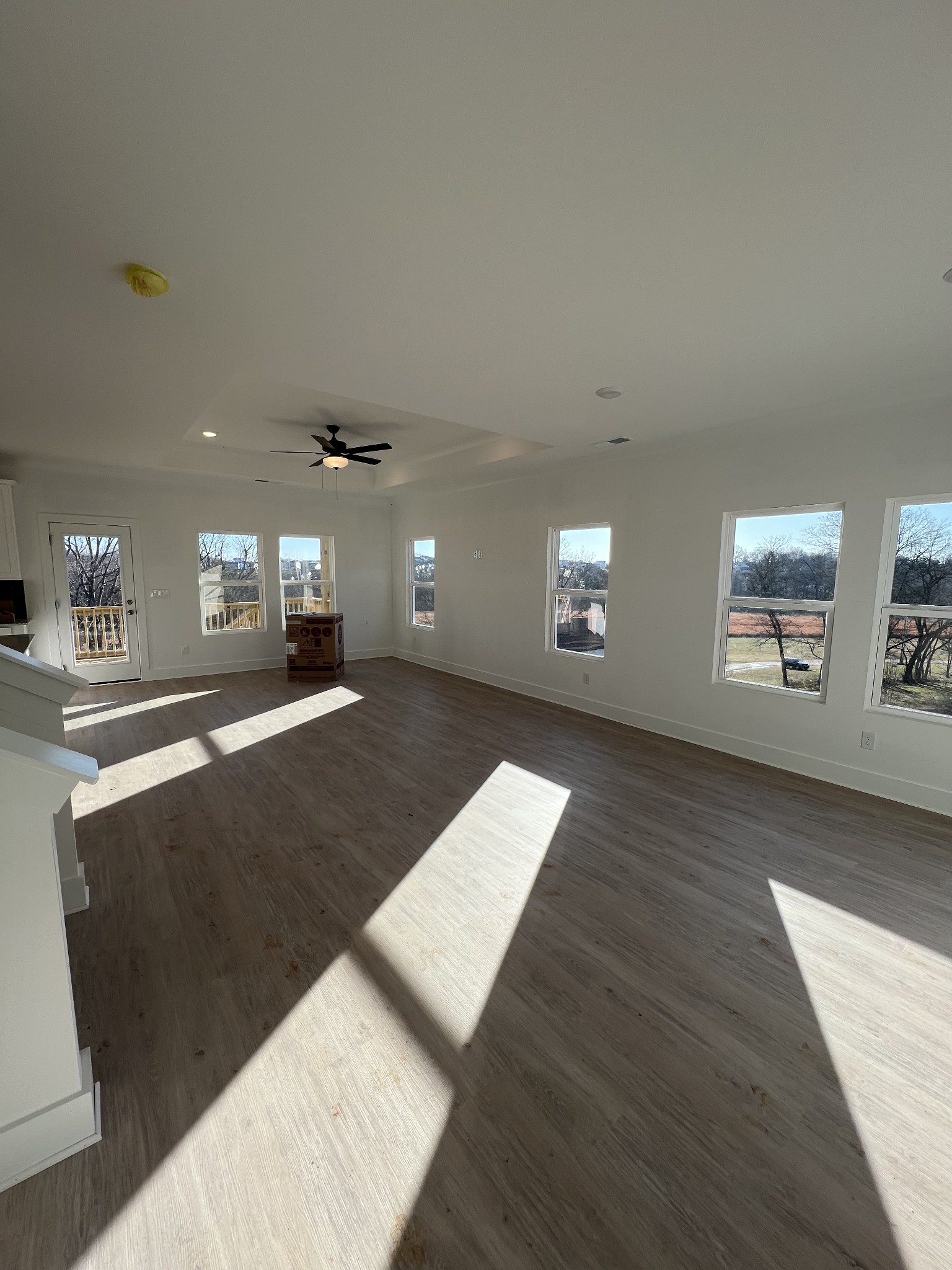 309 Strong Street Columbia, TN 38401 - Photo 6 of 33 a view of a living room a dining room with wooden floor and a kitchen