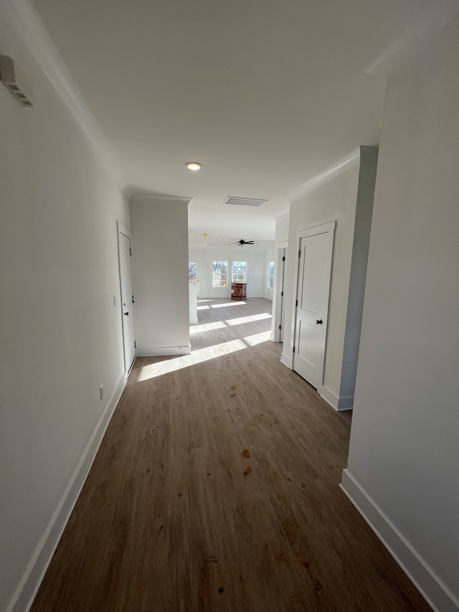 309 Strong Street Columbia, TN 38401 - Photo 8 of 33 a view of a hallway with wooden floor and a refrigerator