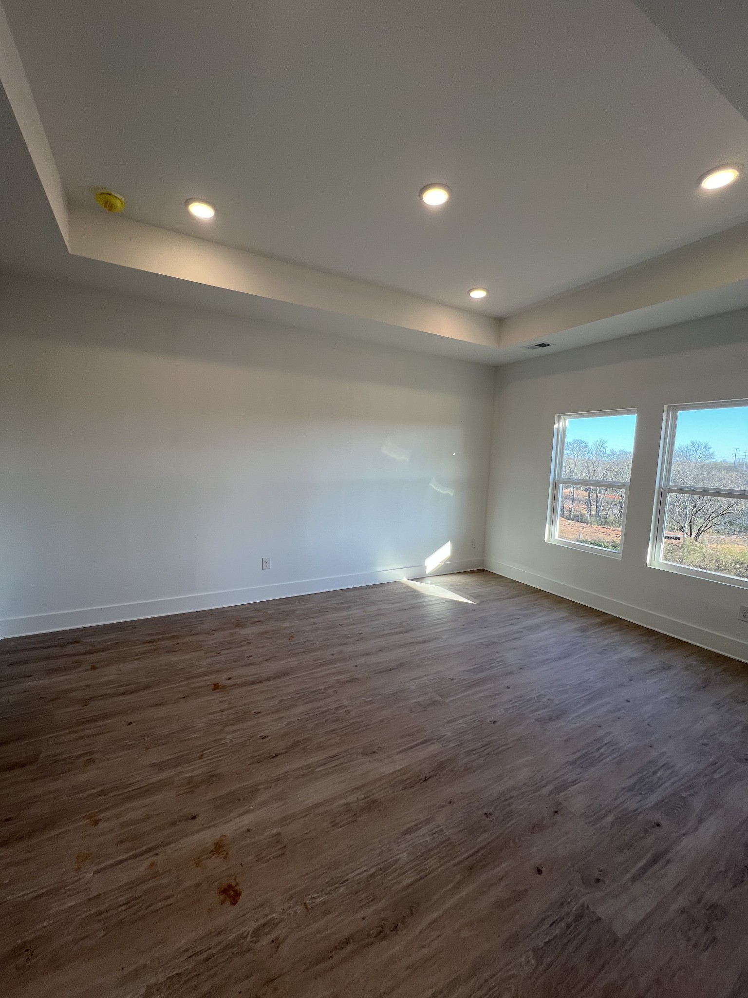 309 Strong Street Columbia, TN 38401 - Photo 10 of 33 an empty room with wooden floor and windows