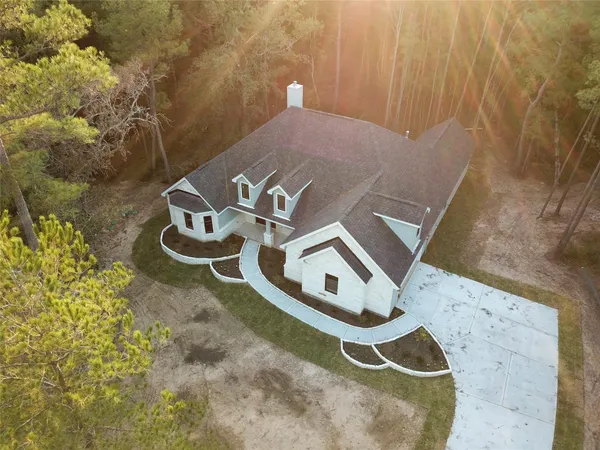 a blue sign that is sitting on a rock