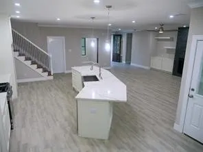 a spacious bathroom with a sink and a mirror