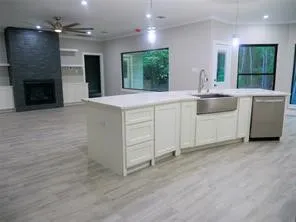 a bathroom with a double vanity sink and a large mirror