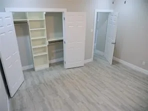 a view of an empty walk in closet