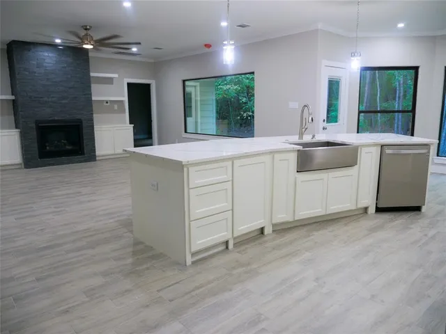 a view of kitchen with furniture and a ceiling fan