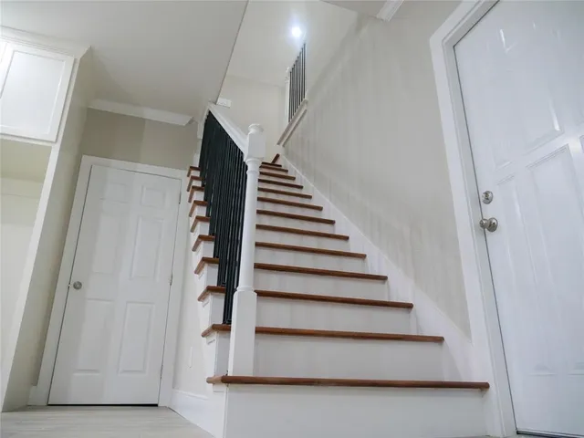 a view of an house with backyard space and windows