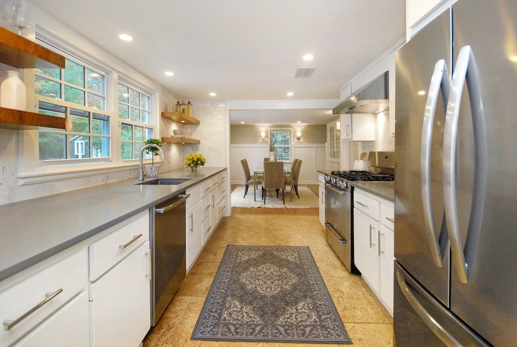 213 Nashoba Road Concord, MA 01742 - Photo 13 of 33 a large white kitchen with a large window