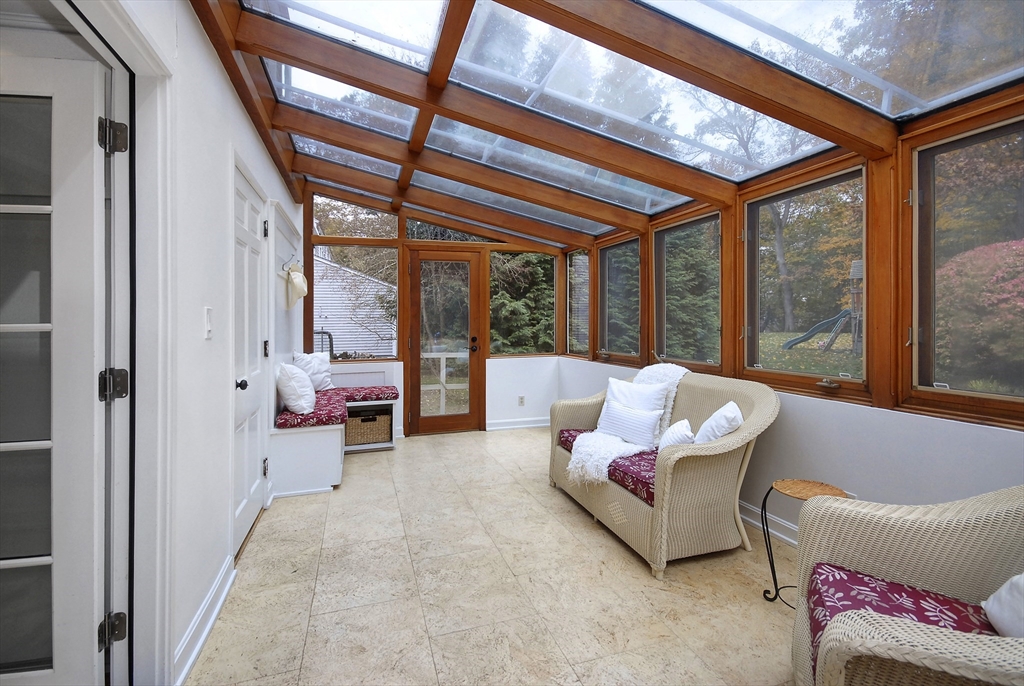 213 Nashoba Road Concord, MA 01742 - Photo 15 of 33 a living room with furniture and a large window with outer view