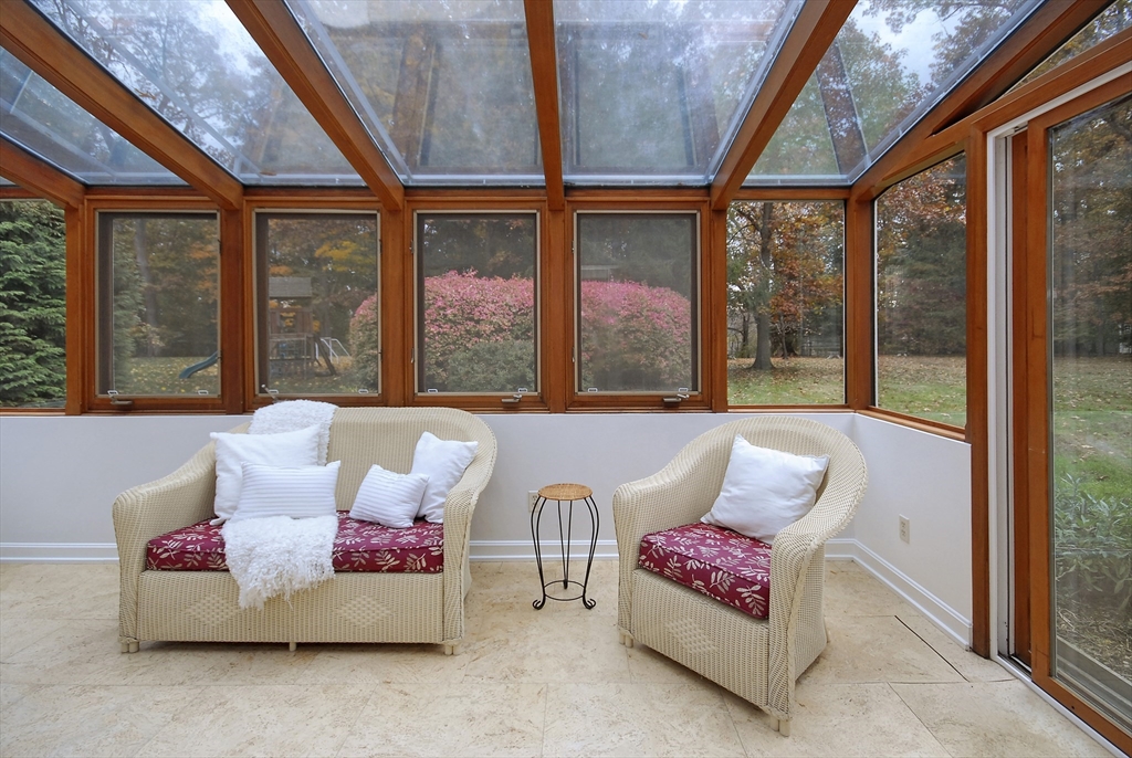 213 Nashoba Road Concord, MA 01742 - Photo 16 of 33 a living room with furniture and a large window