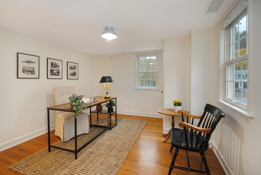 213 Nashoba Road Concord, MA 01742 - Photo 22 of 33 a living room with furniture and wooden floor