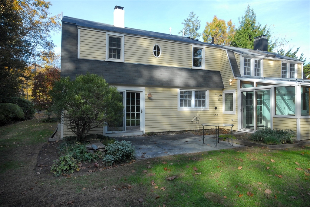 213 Nashoba Road Concord, MA 01742 - Photo 31 of 33 a front view of a house with garden