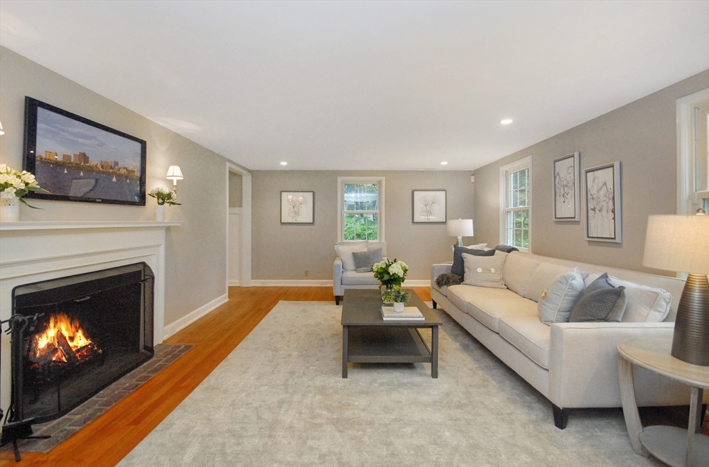 213 Nashoba Road Concord, MA 01742 - Photo 4 of 33 a living room with furniture and a fireplace