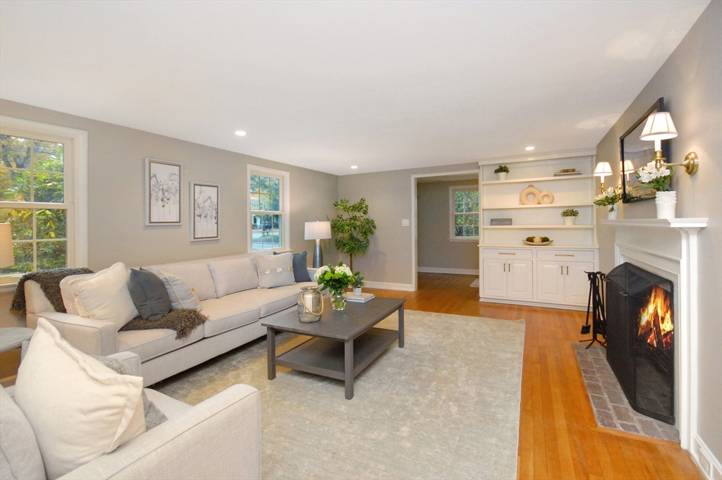 213 Nashoba Road Concord, MA 01742 - Photo 5 of 33 a living room with furniture and a fireplace