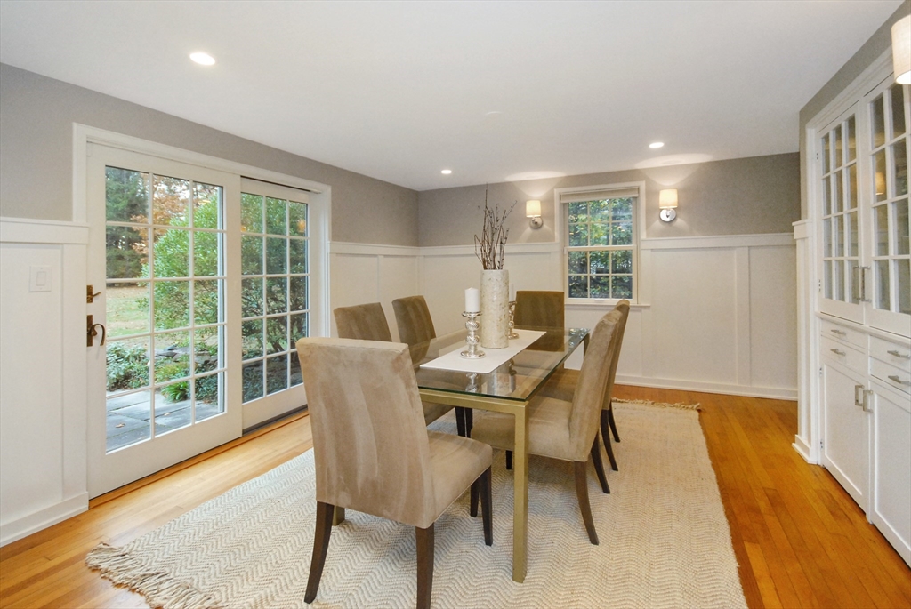 213 Nashoba Road Concord, MA 01742 - Photo 9 of 33 a dining room with furniture and wooden floor