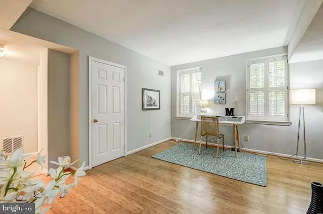 a view of a livingroom with furniture and a window