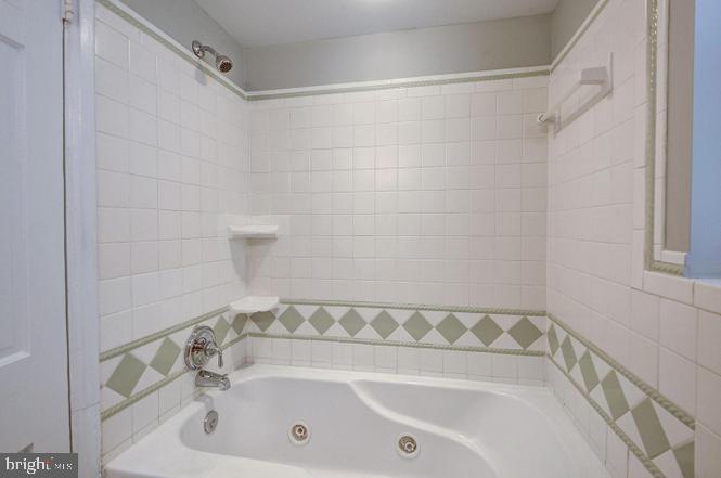 3500 39th Street Northwest, Unit B668 Washington, DC 20016 - Photo 21 of 30 a bathroom with a bathtub and a shower