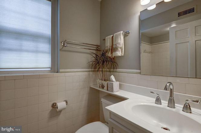 3500 39th Street Northwest, Unit B668 Washington, DC 20016 - Photo 22 of 30 a bathroom with a sink and mirror