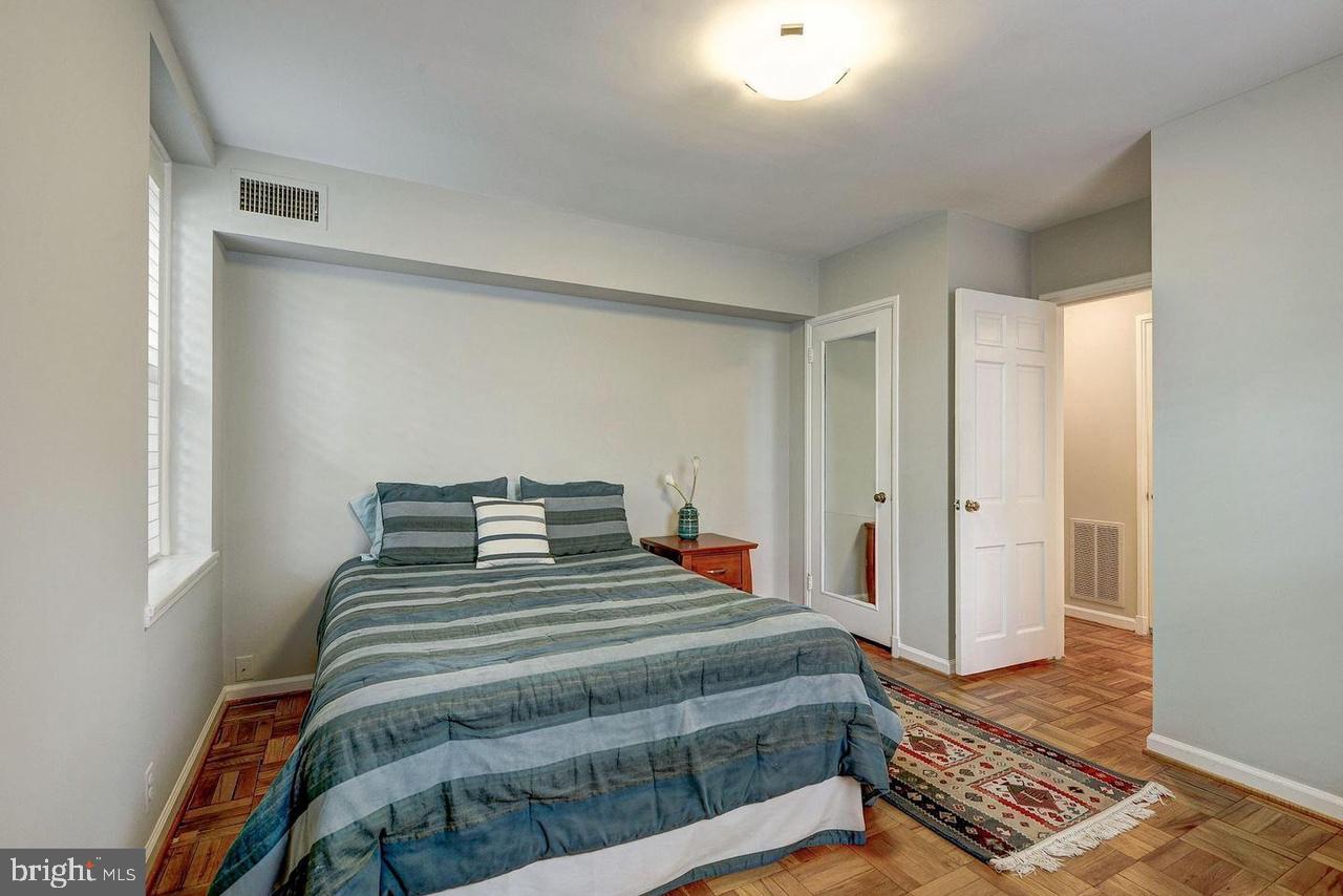 3500 39th Street Northwest, Unit B668 Washington, DC 20016 - Photo 23 of 30 a bedroom with a bed and a window