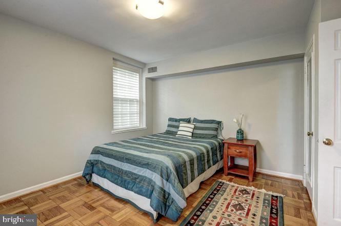 3500 39th Street Northwest, Unit B668 Washington, DC 20016 - Photo 24 of 30 a bedroom with a bed and a window
