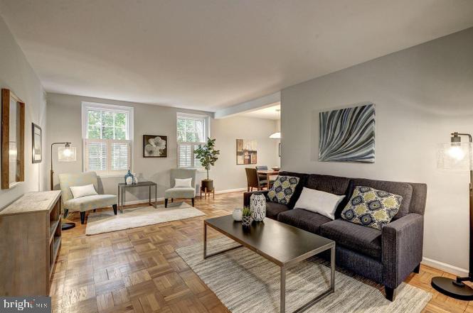 3500 39th Street Northwest, Unit B668 Washington, DC 20016 - Photo 29 of 30 a living room with furniture and wooden floor