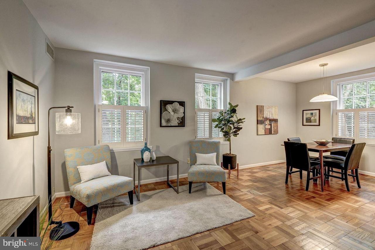 3500 39th Street Northwest, Unit B668 Washington, DC 20016 - Photo 8 of 30 a living room with furniture two window and a table