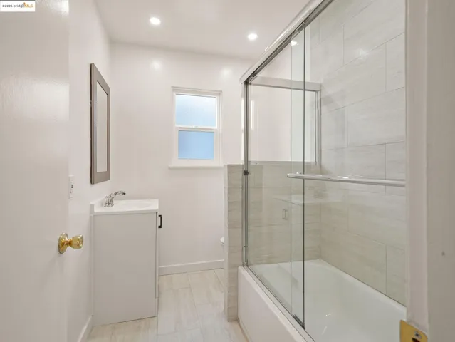 a bathroom with a bathtub and shower
