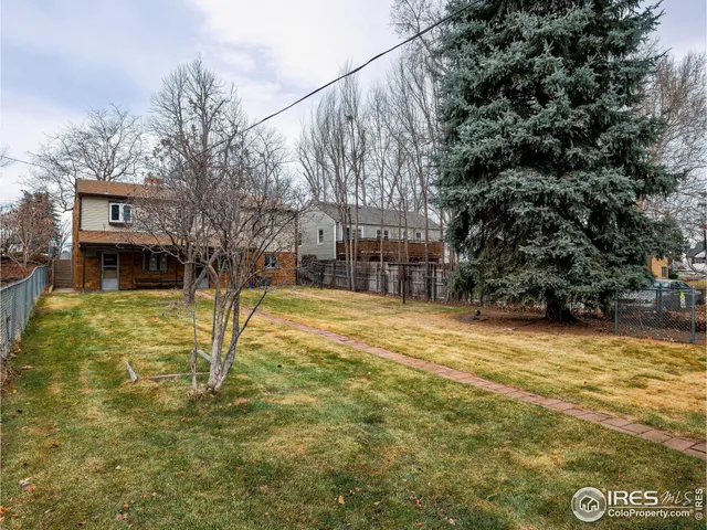 a swimming pool with trees in the background