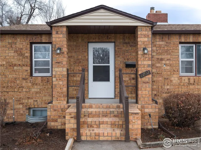 a front view of a house with glass windows