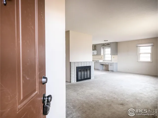 a view of a livingroom with a fireplace