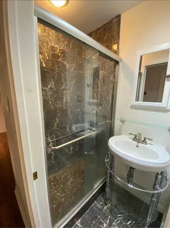 a bathroom with a sink and mirror