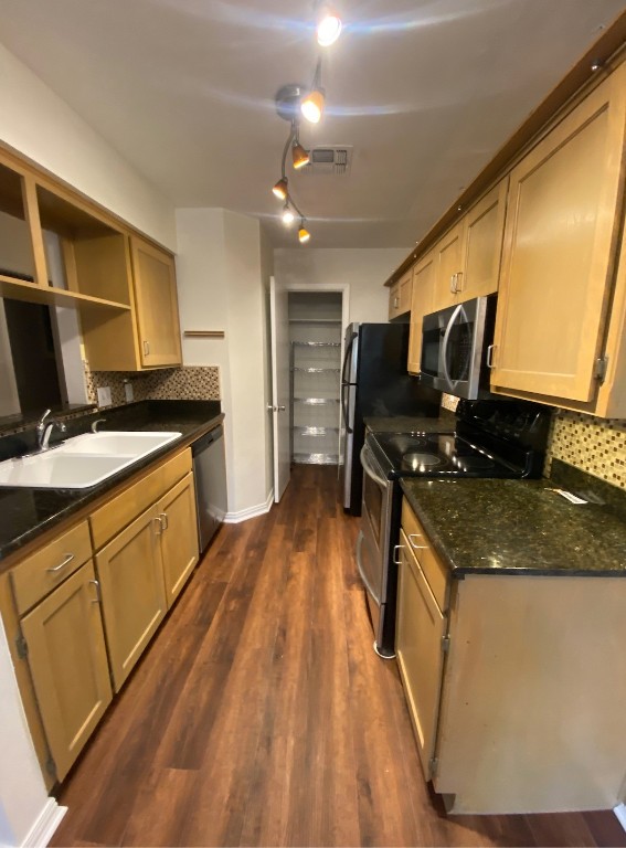 2906 West Avenue, Unit 4 Austin, TX 78705 - Photo 2 of 16 a kitchen with stainless steel appliances granite countertop a sink stove and refrigerator
