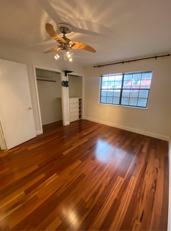 2906 West Avenue, Unit 4 Austin, TX 78705 - Photo 6 of 16 a view of an empty room with wooden floor and a window