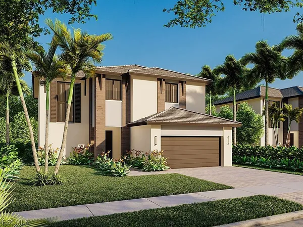 a front view of a house with a garden and entryway