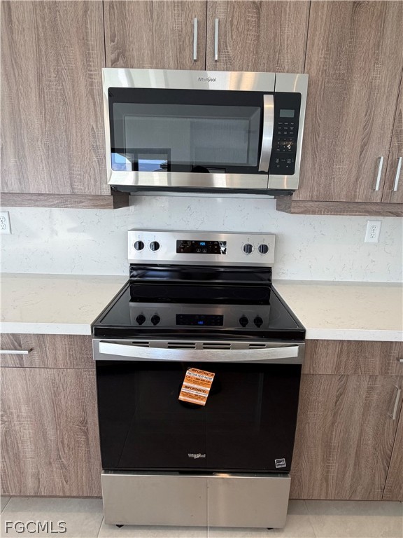 5166 Julienne Road Immokalee, FL 34142 - Photo 14 of 29 a stove top oven sitting inside of a kitchen