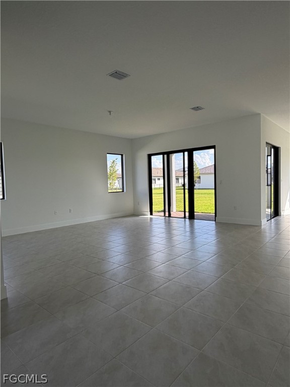 5166 Julienne Road Immokalee, FL 34142 - Photo 2 of 29 a view of an empty room with window and wooden floor