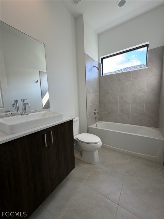 5166 Julienne Road Immokalee, FL 34142 - Photo 29 of 29 a bathroom with a sink vanity mirror and toilet