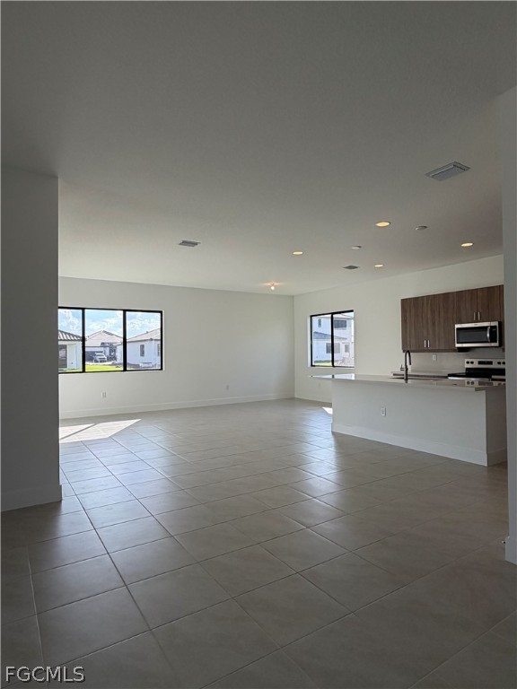 5166 Julienne Road Immokalee, FL 34142 - Photo 6 of 29 a view of a kitchen with a sink and a refrigerator