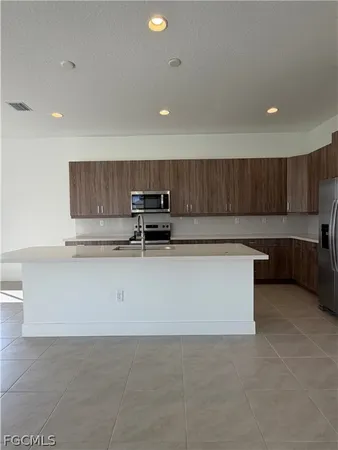 a view of kitchen with wooden floor and window